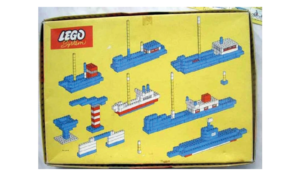 Retro LEGO System box illustrating multiple ship designs built from basic LEGO bricks.