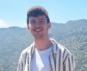 July Star Student Matt Bond smiling outdoors with mountains in the background, celebrating his achievement at Accountancy Learning.