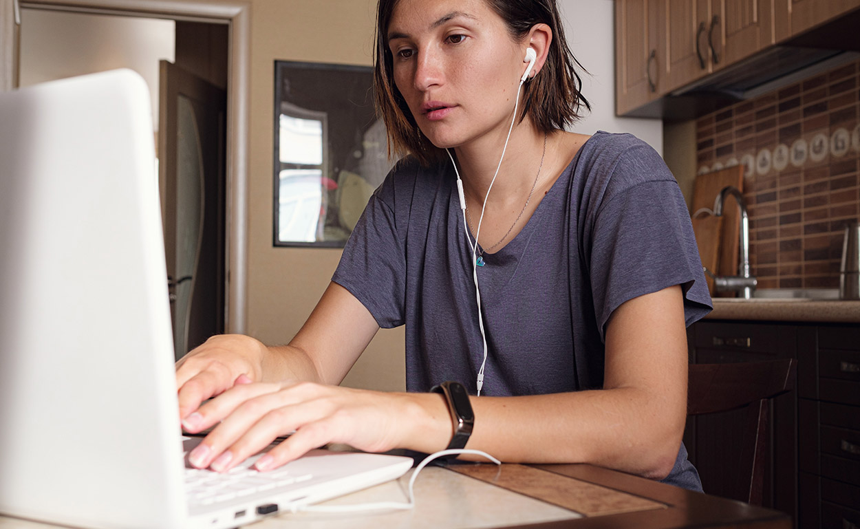 Adult learner studying accountancy online at home using a laptop, representing flexible distance learning.